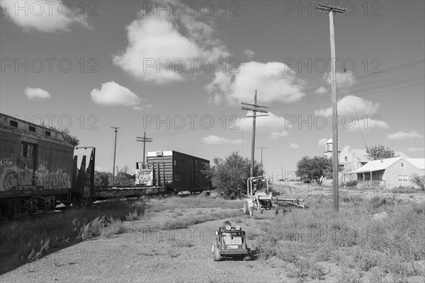 Caucasian boy driving toy car near train