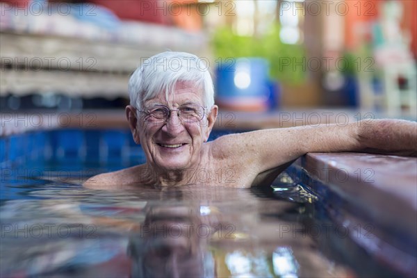 Portrait of smiling Caucasian man in swimming pool