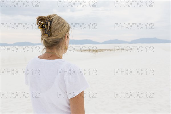 Caucasian woman admiring scenic view of desert