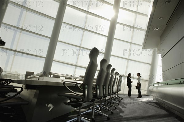 Businesswomen talking in conference room