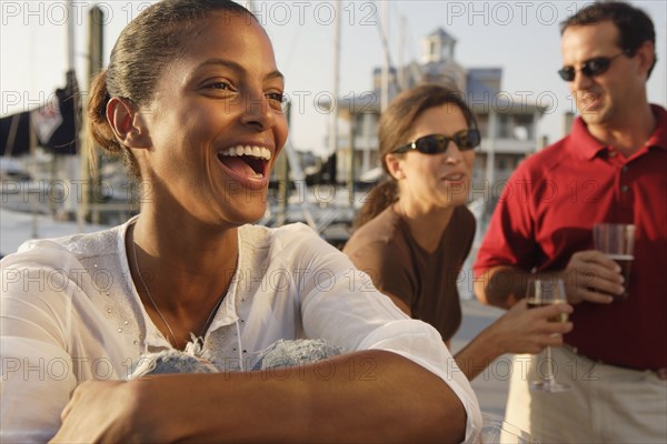 Friends having drinks at marina