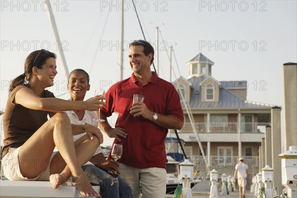 Friends having drinks at marina