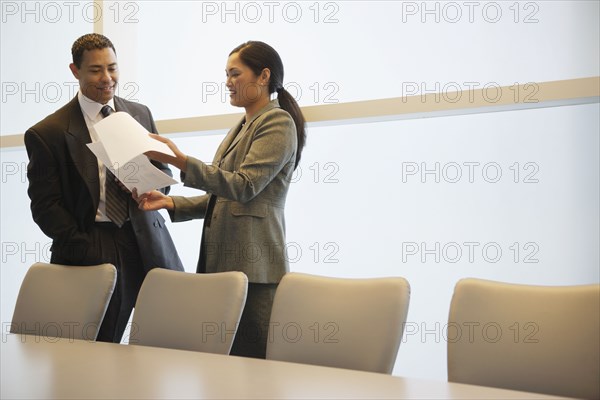 Multi-ethnic businesspeople discussing paperwork