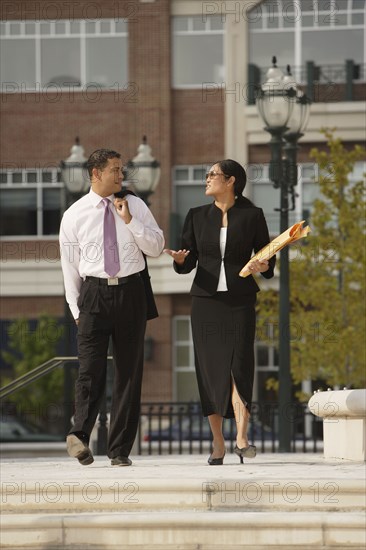 Multi-ethnic businesspeople talking outdoors