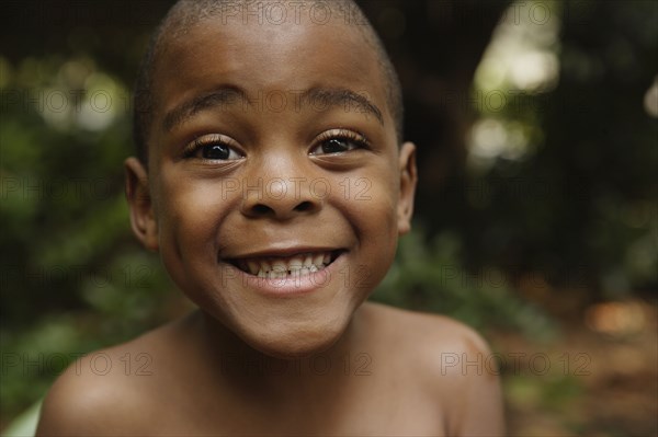 Close up of African American boy smiling