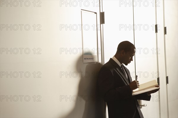 African American businessman looking at paperwork