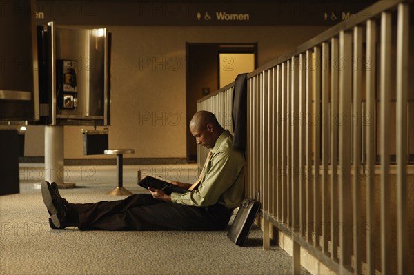 African businessman reading book