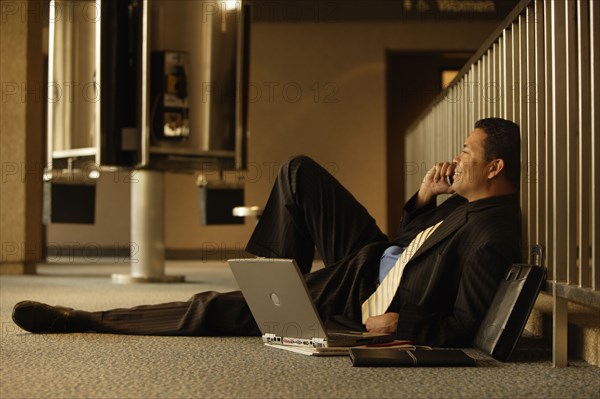 Hispanic businessman talking on cell phone