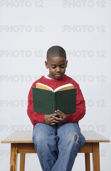 African boy reading book