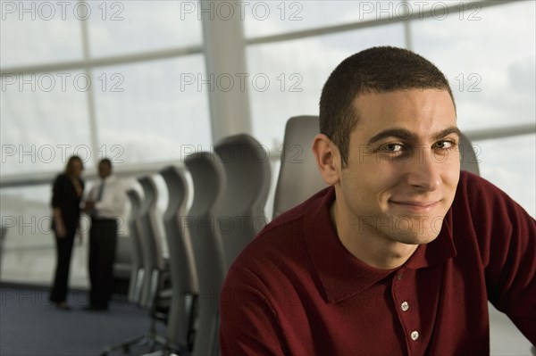 Mixed race businessman in conference room