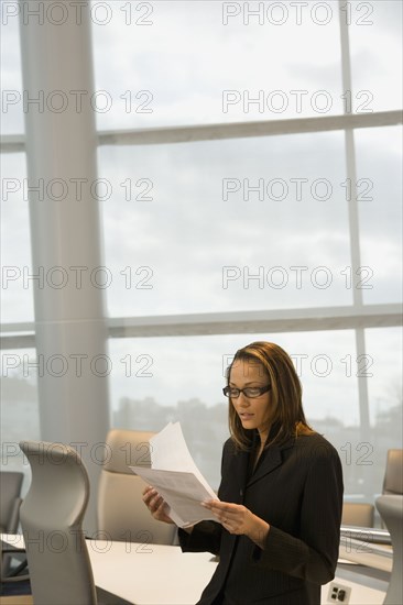 African businesswoman reviewing paperwork