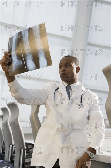 African doctor reviewing x-ray