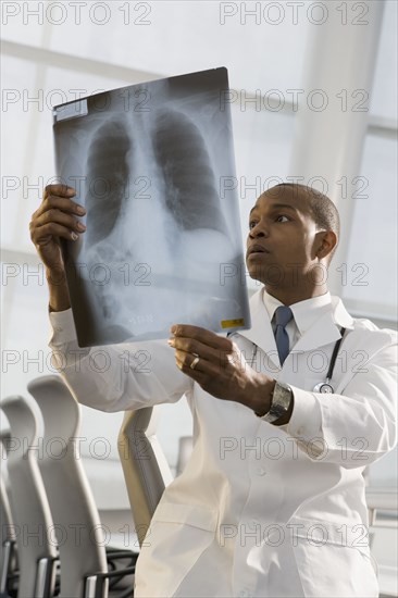 African doctor reviewing x-ray