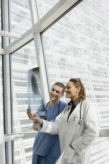 Multi-ethnic doctor and nurse reviewing x-ray