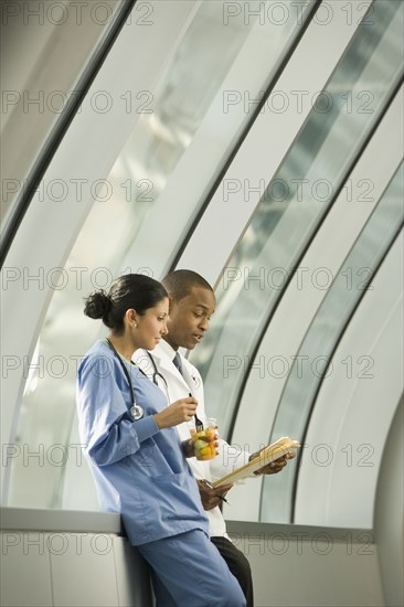 Doctor and nurse reviewing medical chart