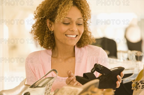 Mixed race woman shoe shopping