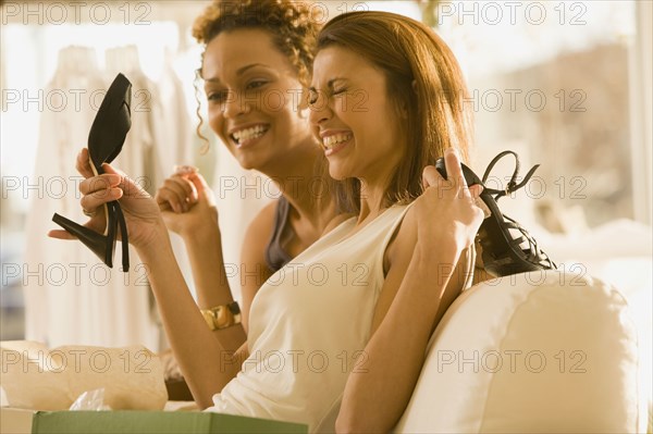 Multi-ethnic women shoe shopping