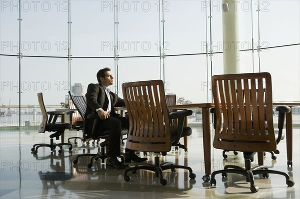 Businessman waiting in conference room for meeting