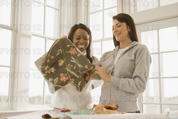 Women holding fabric swatch