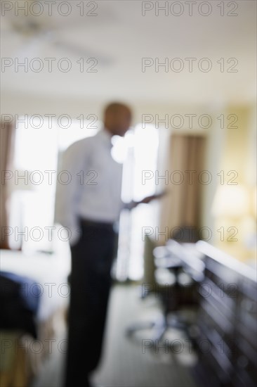 Defocused African businessman in hotel