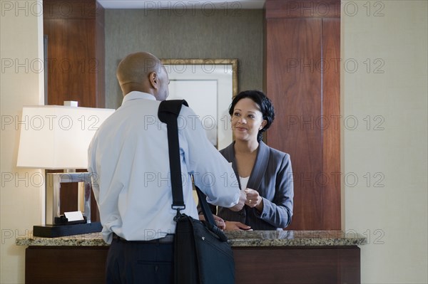 African businessman at hotel check-in