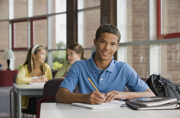 Mixed race teenager doing homework