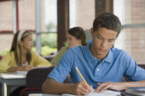 Mixed race teenager doing homework