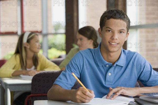 Mixed race teenager doing homework