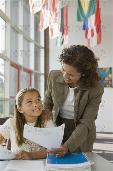 Teacher helping student wit homework