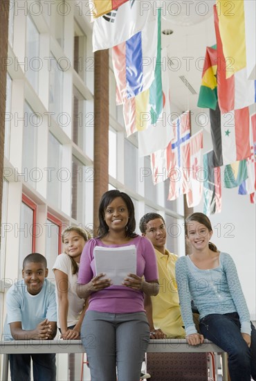 Teacher and students posing in classroom