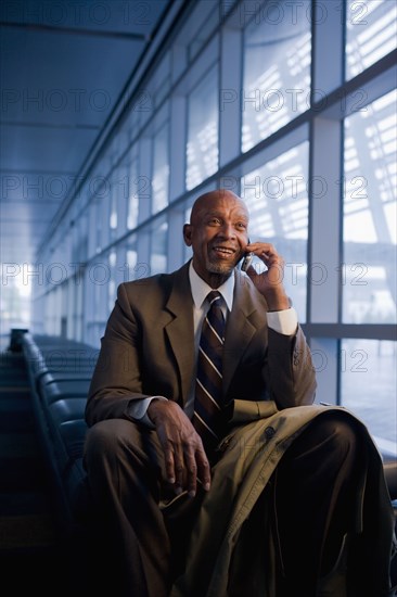 African businessman using cell phone