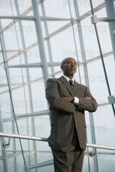 African businessman standing with arms crossed