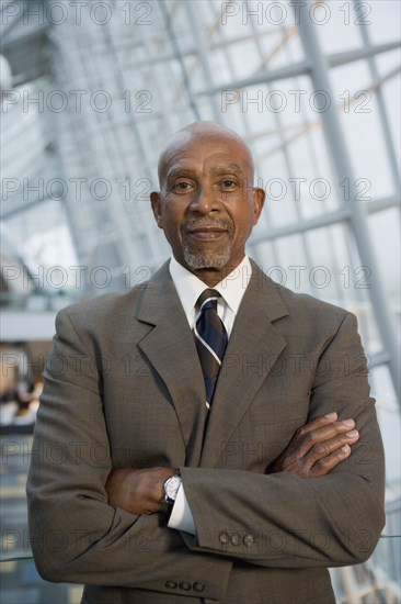 African businessman with arms crossed