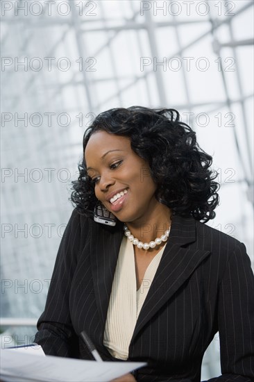 African businesswoman using cell phone