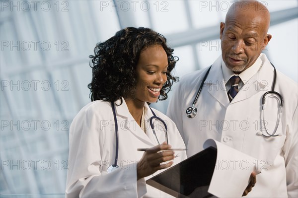 African doctors reviewing medical chart