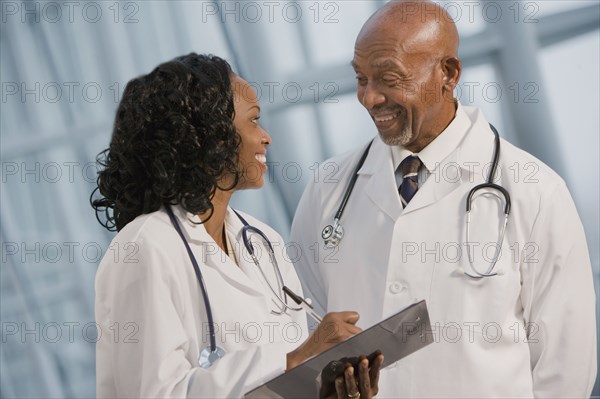 African doctors reviewing medical chart