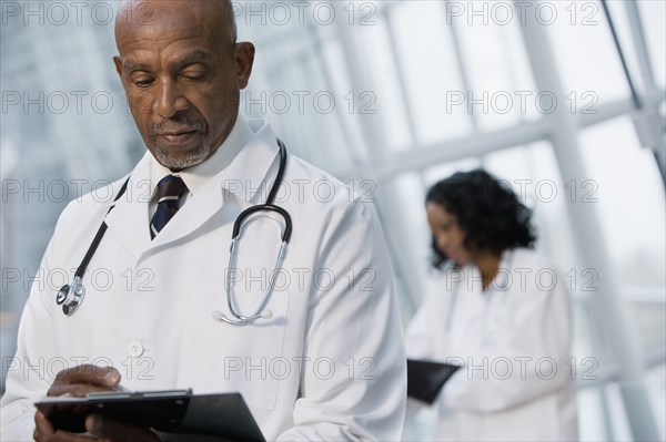 African doctor reviewing medical chart