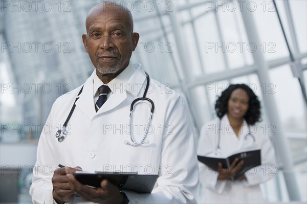 African doctor reviewing medical chart