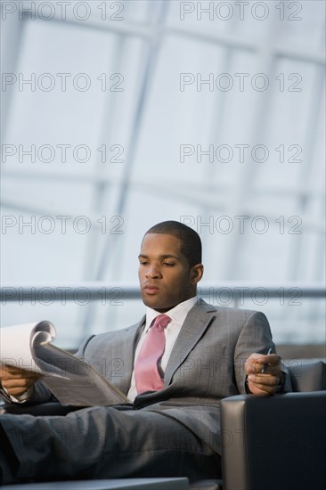 African businessman reviewing paperwork