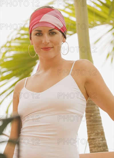 Mixed race woman in headscarf outdoors