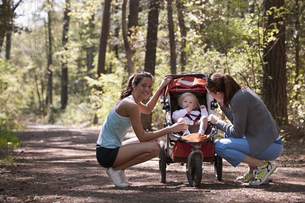 Women and baby on nature trail