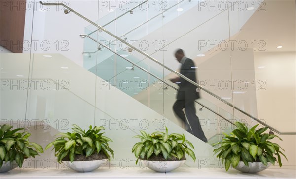 African American businessman ascending staircase
