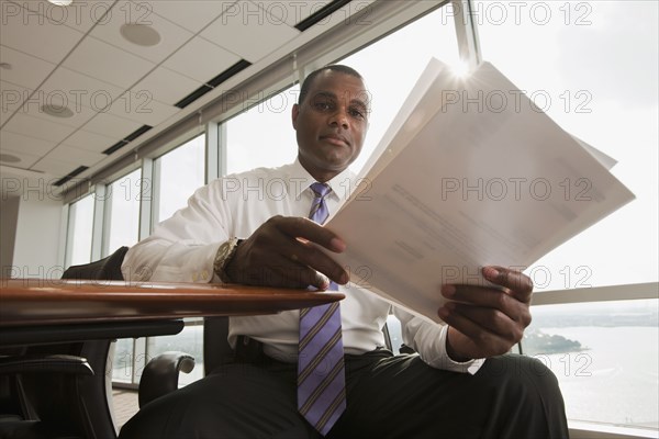 African American businessman reviewing paperwork