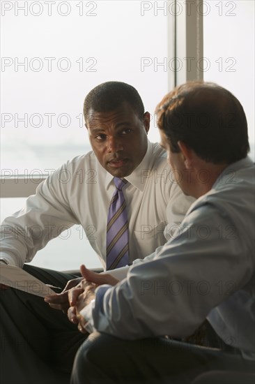 Businessmen having meeting in office