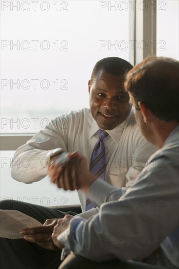 Businessmen shaking hands in agreement