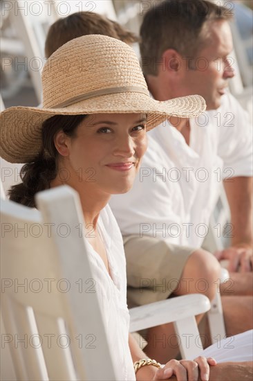 Smiling Caucasian woman sitting with family