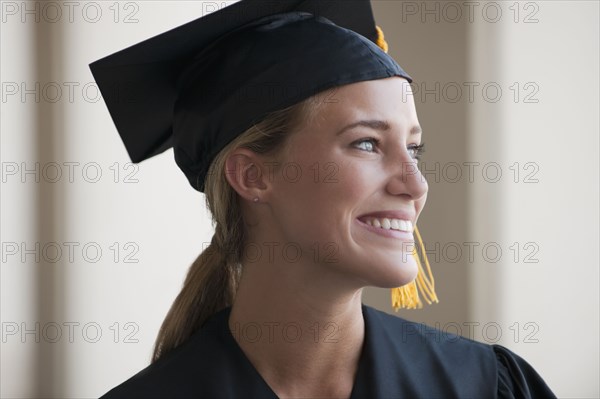Caucasian graduate in cap and gown