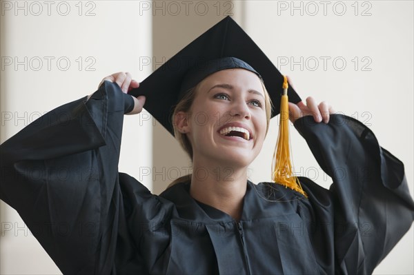 Caucasian graduate in cap and gown