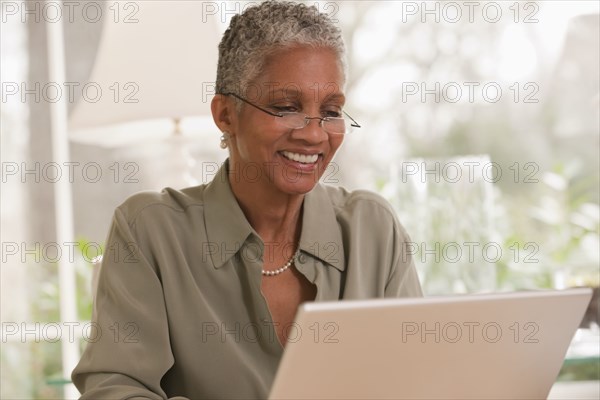 Black woman working on laptop