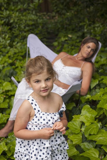 Caucasian mother and daughter in garden